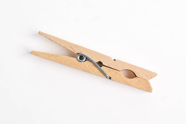 istock Wooden clothes pin on white background 2222395440