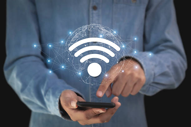 istock Hand holding Wi-Fi internet, wireless network with icons on young man's hand 2222396327