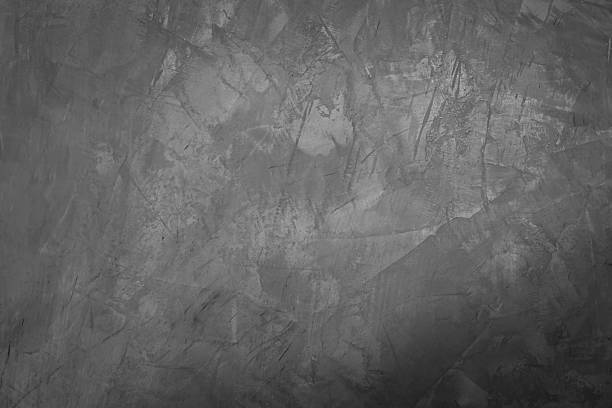 istock black and white textured concrete wall background 2222396424