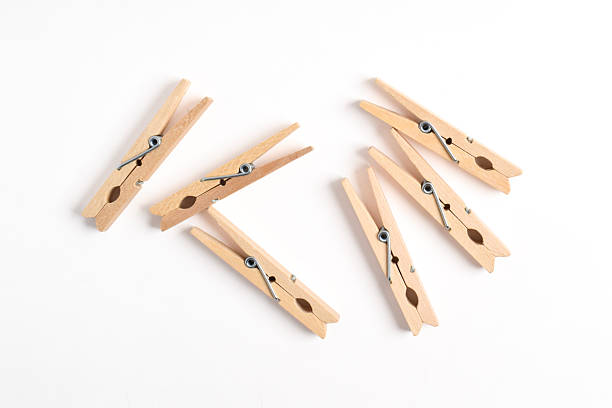 istock Wooden clothes pin on white background 2222398573
