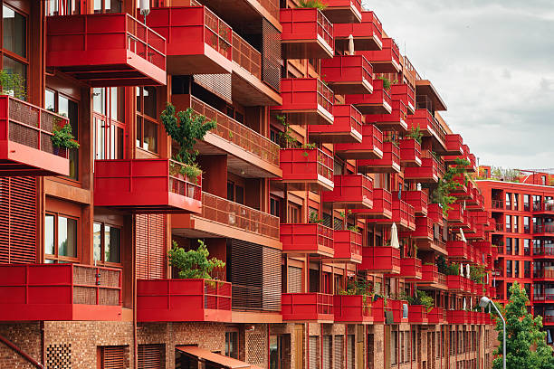 istock modern red facade with cubic balconies 2222398579