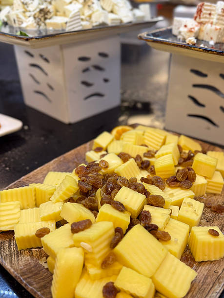 istock Sliced hard cheese with raisins on buffet table. snack in all-inclusive restaurant setting 2222401091