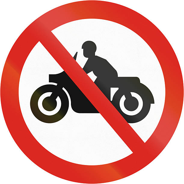 istock Regulatory road sign in Uganda - No entry for motorcycles 2222401409