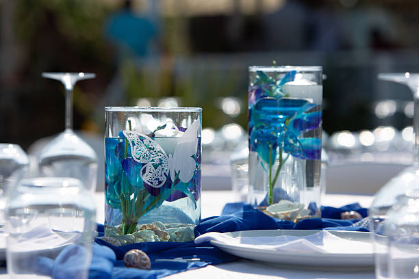 istock Elegant outdoor wedding reception table setting featuring blue flowers and butterfly decorations 2222402429
