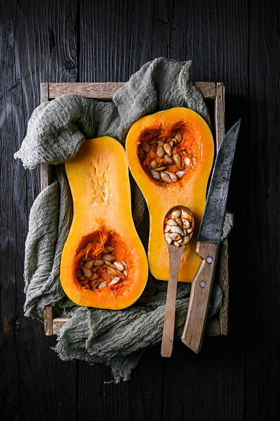istock Halved raw butternut squash with seeds 2222403570