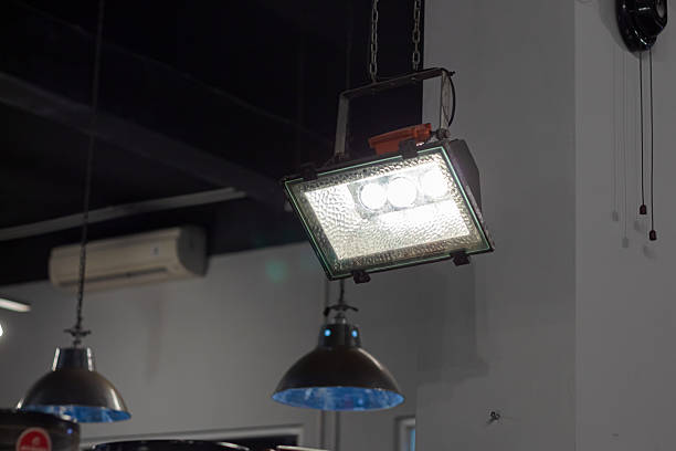 String of yellow lights on metal roof.