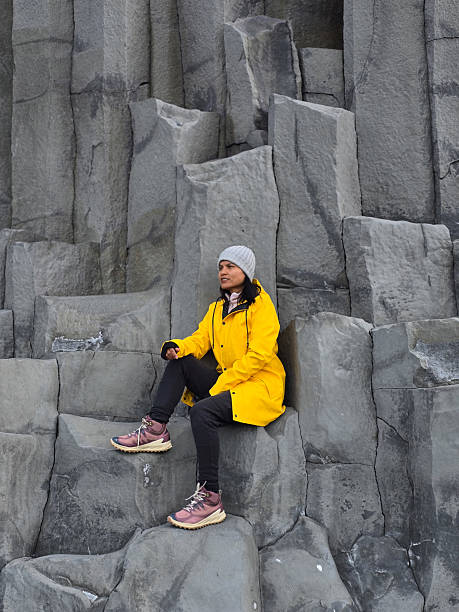 istock Exploring the dramatic basalt columns of Reynisfjara Beach in Iceland during a cloudy day 2222404548