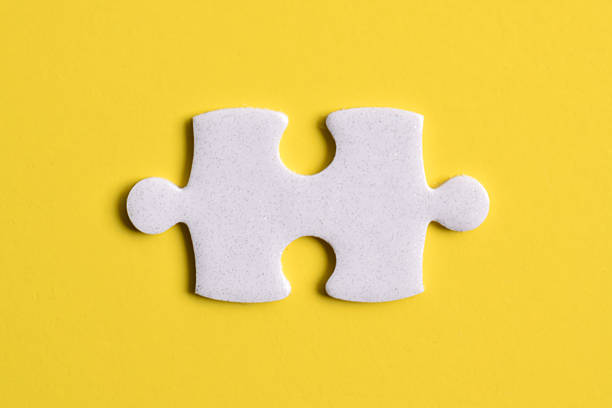 Jigsaw puzzle pieces removed from other jigsaw. Customizable space on jigsaw for text or ideas.