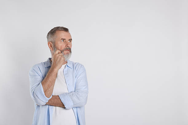 istock Portrait of senior man on white background, space for text 2222405527