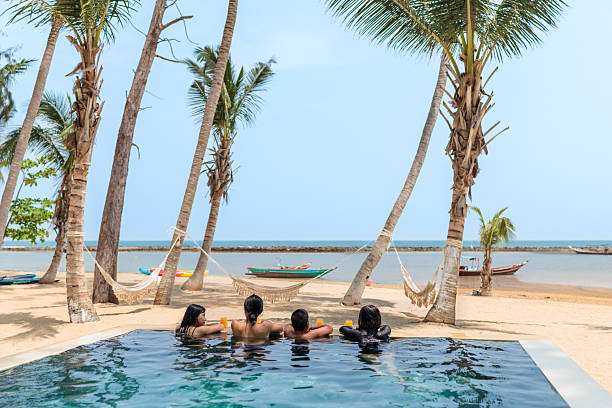 istock Family Relaxing by the Pool 2222409013