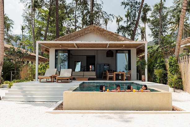 istock Family Relaxing by the Pool 2222409124