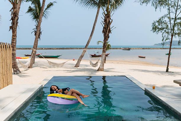 istock Young girl relaxing on inflatable ring 2222412747