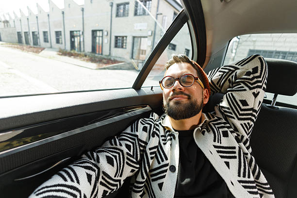 istock Stylish Man Relaxing in Car Backseat 2222418687