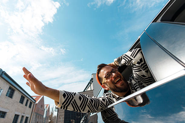 istock Excited Man Celebrating from Car Window 2222418697
