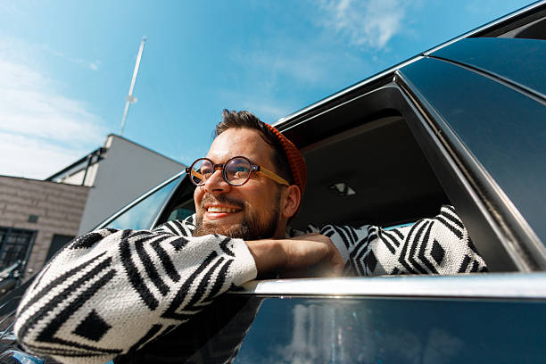 Excited Man Celebrating from Car Window