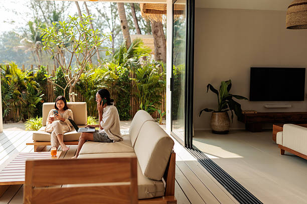 istock Woman relaxing while man working on his computer on vacation 2222419143