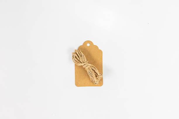 istock Blank Brown Kraft Paper Tag with Jute String for hanging on White Background 2222421473