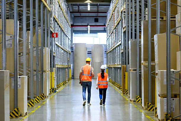 istock Warehouse Workers in Safety Gear 2222421598