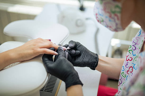 istock Close-up of nail technician making a manicure. 2222422411
