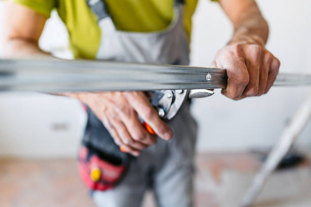 istock Mature Worker Holding A Gypsum Board Profile In An Empty Apartment Under Renovation 2222423227