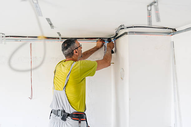 istock Mature Worker Installing Gypsum Board Profiles With A Drill On The Ceiling In An Empty Apartment Under Renovation 2222423391