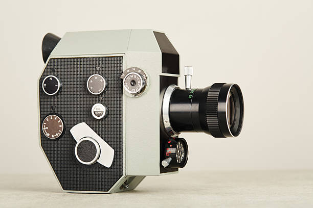 istock Old fashioned analog 8mm film movie camera on white background 2222423829