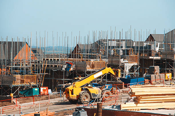 istock Forklift mowing across busy construction site 2222427060