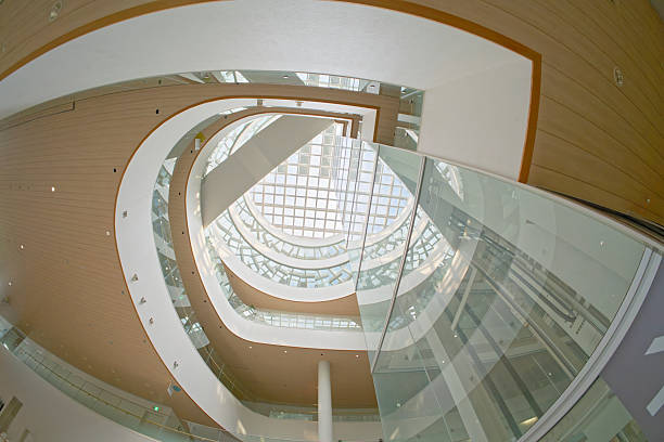 istock Modern building interior with curved floors, skylights and glass walls 2222428295