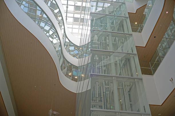 istock Modern building interior with curved floors, skylights and glass walls 2222429493
