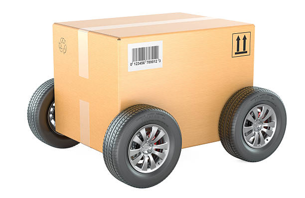 Cardboard shipping box with car wheels. Fast, mobile delivery, concept. 3D rendering isolated on white background