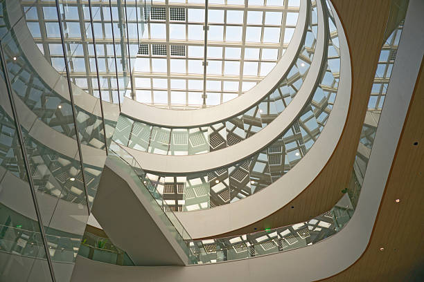 istock Modern building interior with curved floors, skylights and glass walls 2222432045