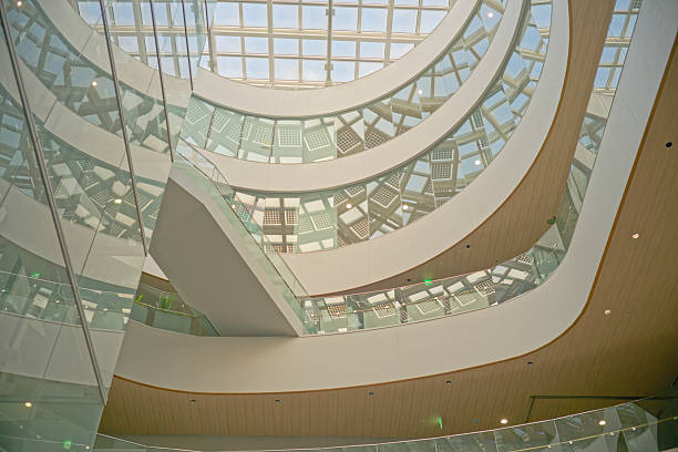 istock Modern building interior with curved floors, skylights and glass walls 2222432046