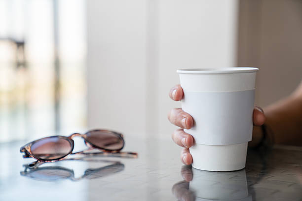 Ice brew coffee with reading glasses on the table