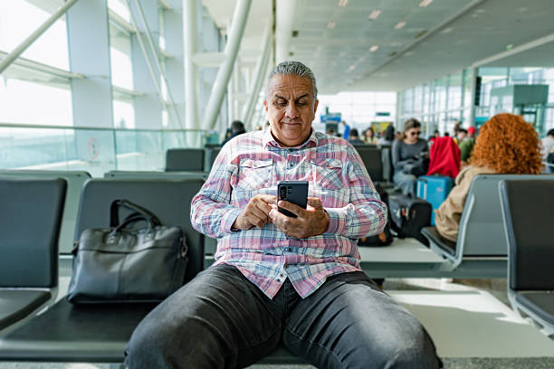 istock Man talking on cell phone at airport 2222440467