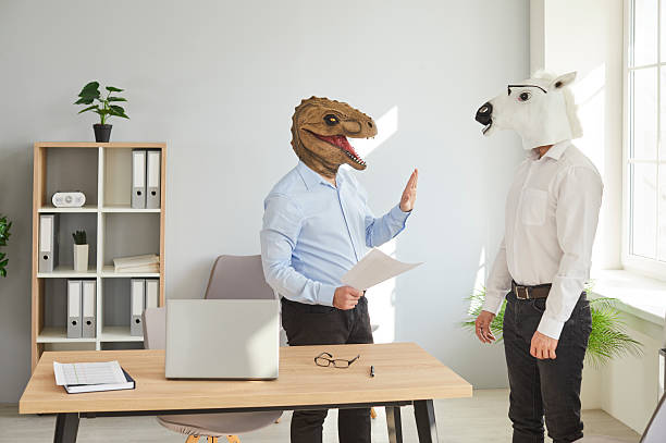 istock Two businessmen in animal masks working in office 2222441086
