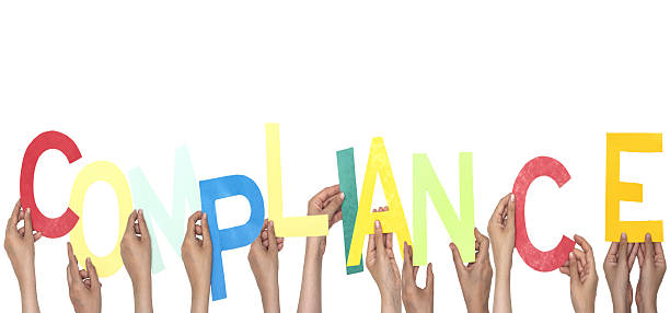 istock Hands Holding Colorful Letters Forming The Word Compliance 2222442465