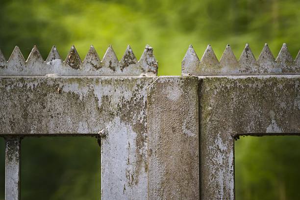 A concrete fence encloses the area of construction work for the construction of a new residential apartment building