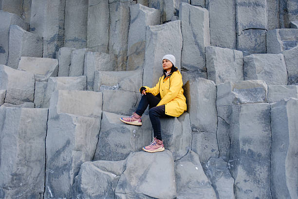 Exploring Reynisfjara Beach with striking basalt columns by the Atlantic Ocean