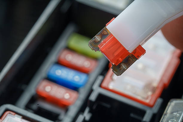 Hand Removing Blown Automotive Fuse