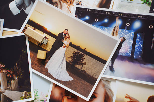 istock Wooden USB flash drive on printed wedding photos. 2222449855