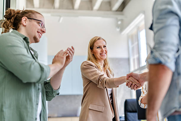 istock Team members celebrating a successful collaboration in a modern office setting during working hours 2222451379