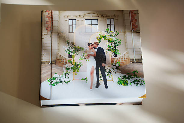 istock a closed photo book with wedding photos on a white table 2222451442