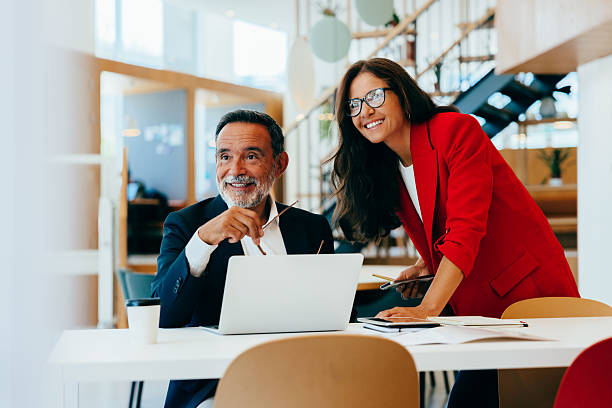 istock Two senior managers planning together at an office during a business meeting 2222452607
