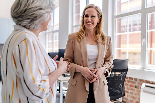 istock Professionals engage in a productive discussion in a modern office environment during working hours 2222452976