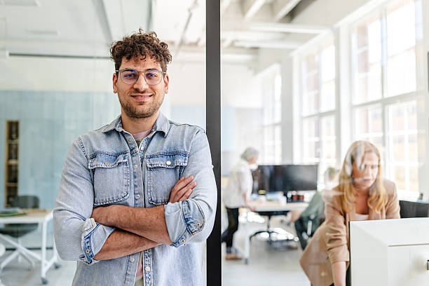 istock Professional adults collaborating in a modern office environment during working hours 2222453573