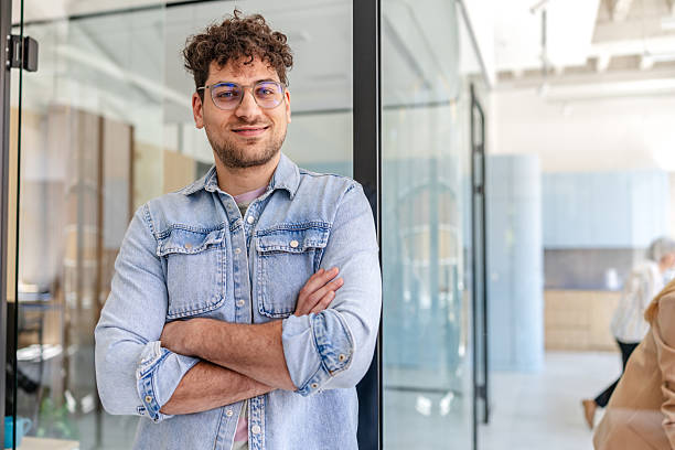 istock Professional adult in modern office environment engaging with coworkers during work hours 2222453718