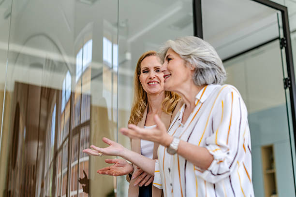 istock Business colleagues engage in a discussion in a modern office setting during the workday 2222454391