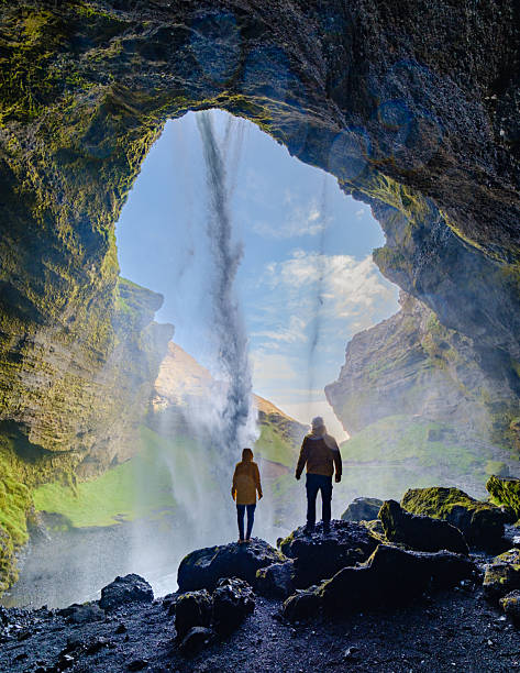 istock Majestic waterfall flowing through a cave at Kvernufoss, Iceland during a sunny day 2222455480