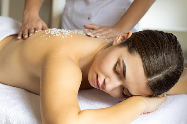 istock Woman getting salt massage at a spa 2222459536