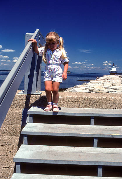 istock Portland Maine - Girl & Spring Point Ledge Light - 1985 2222460096